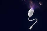 LumaSky projector lighting up a ceiling with a galaxy and moon